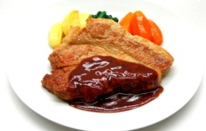 Replica of fried pork with wine sauce and vegetables