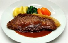 Replica of fried pork with wine sauce and vegetables