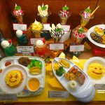Balanced and visually appealing kids meal replicas in restaurant showcase