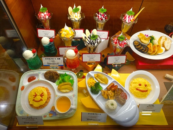 Balanced and visually appealing kids meal replicas in restaurant showcase