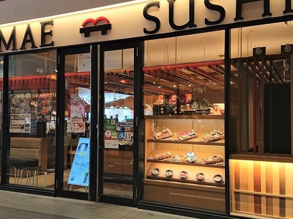 Restaurant showcase with food replicas lacking price tags and themed decoration