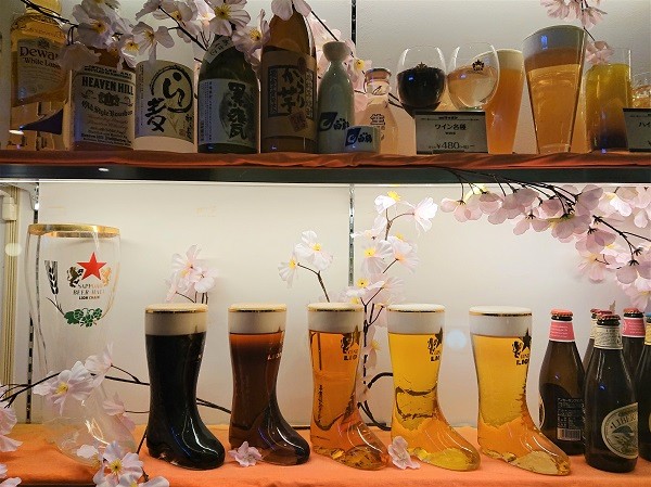 Beer food replicas displayed in unique mugs to attract customers