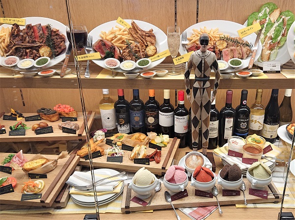 Fake food replicas in restaurant showcase decorated with seasonal and festive décor