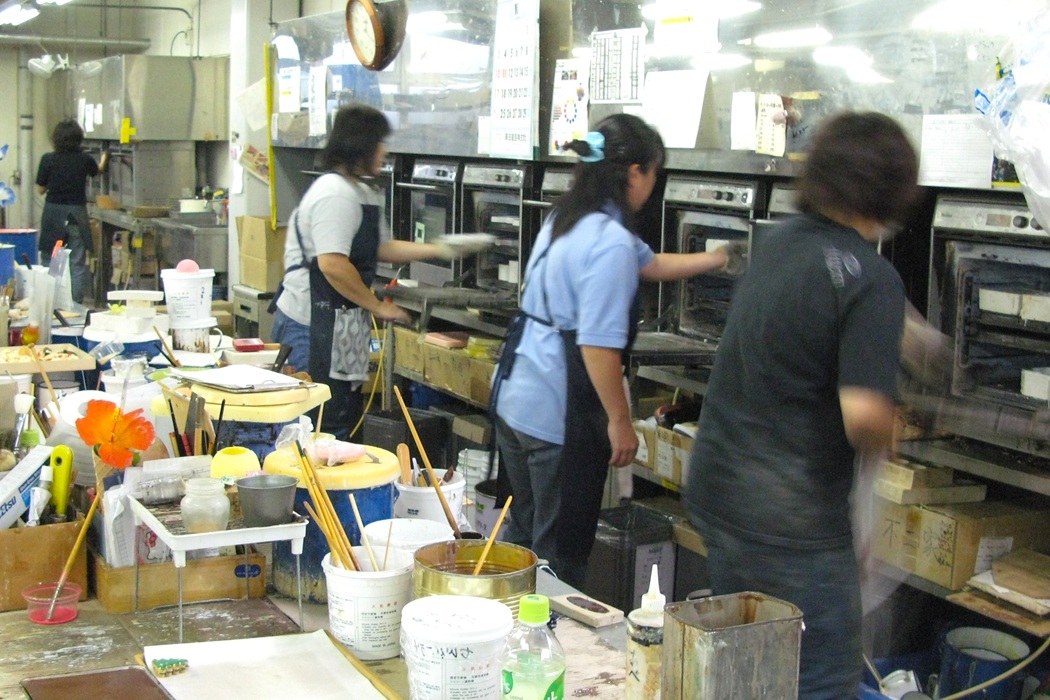 Japanese workshop assistants supporting food replica masters by firing silicone parts of future dishes in special ovens