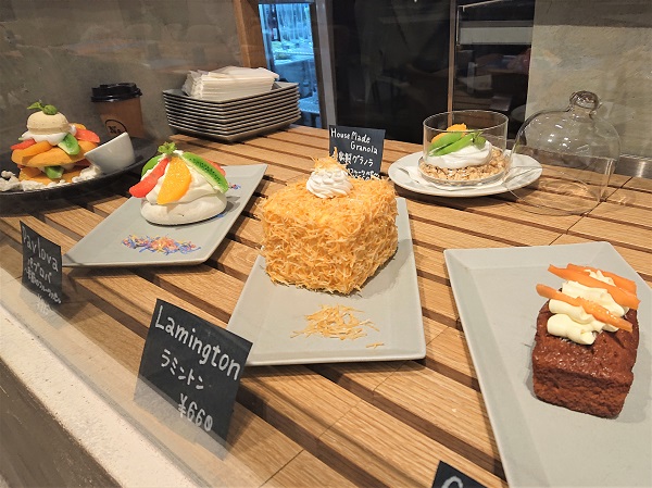Food replicas with price tags showing dish names and costs in restaurant showcase