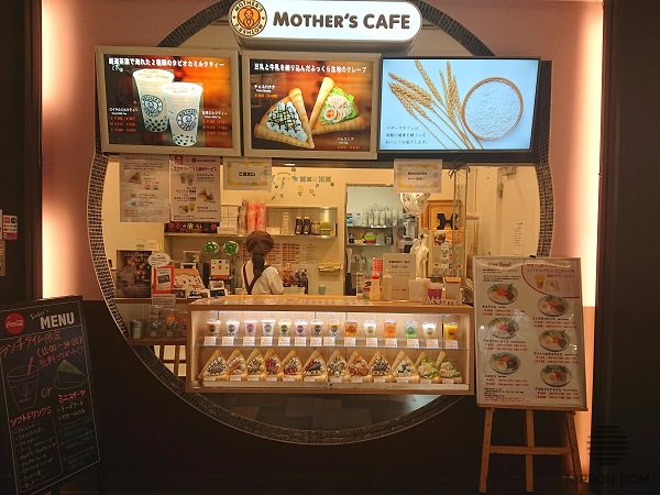 Oversized food images above counter in food court clearly showing menu items