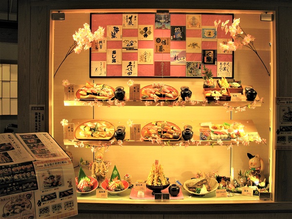 Restaurant display with food replicas decorated with holiday and seasonal décor