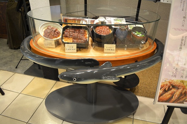 Outdoor display box with food replicas presenting restaurant’s best dishes