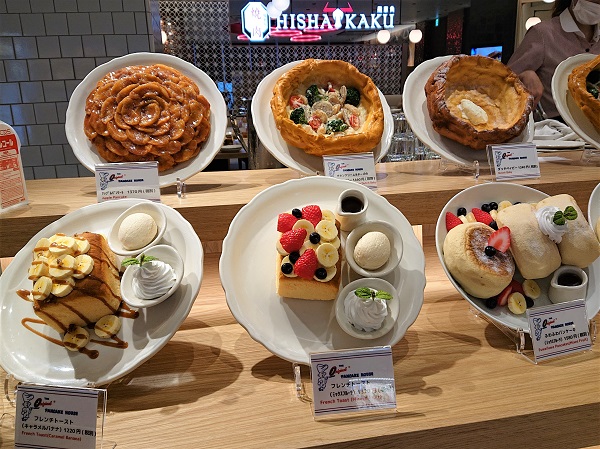 Tiered café showcase with fake food replicas clearly displayed