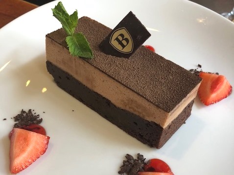 Dessert Chocolate cake with raspberry coulis