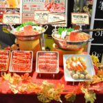 Seasonal restaurant window decoration — shabu-shabu food replicas with autumn maple leaves, Japanese kisetsu wo sakidori principle in practice