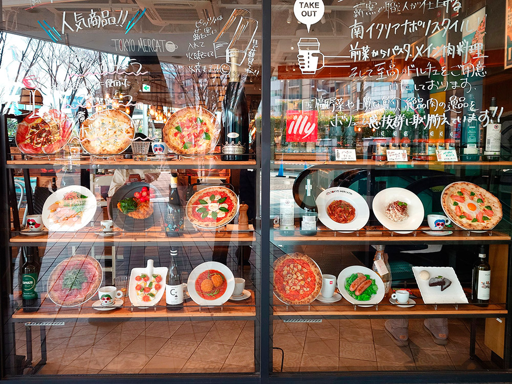 Pizza display models scattered across different shelves instead of one group