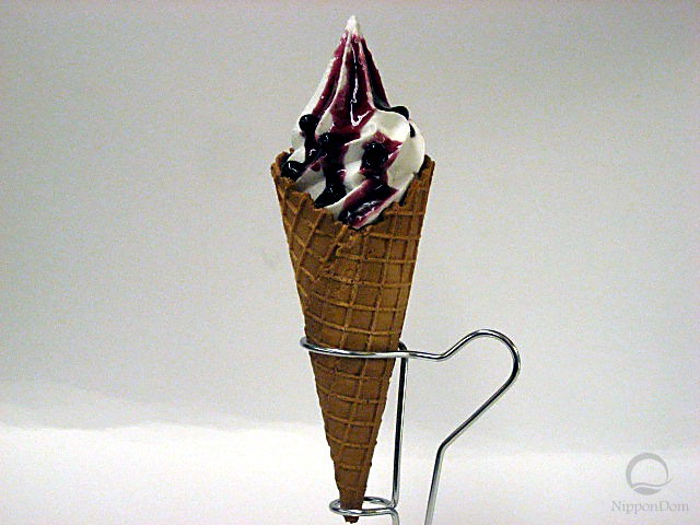 Blueberry sauce vanilla waffle cone