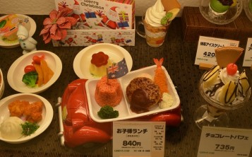 Fake food dishes from the children's menu in a restaurant window