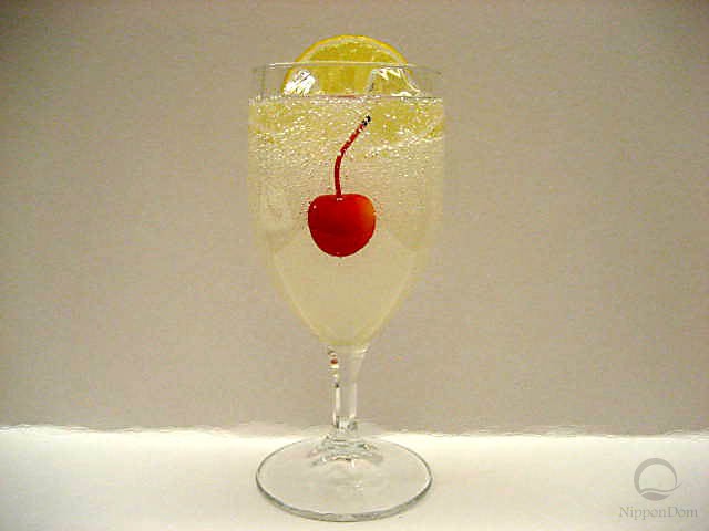 Lemonade decorated with a slice of lemon and a cherry