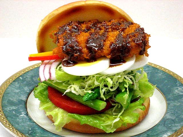 A replica of burger with salad