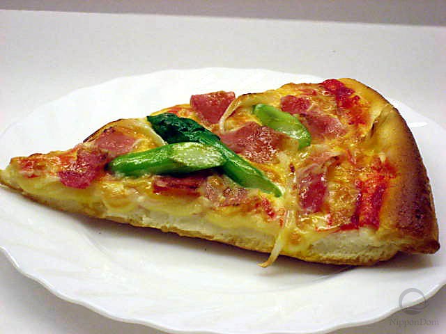 A slice of bacon pizza