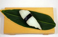 Replica of sushi “squid (7) with nori seaweed”